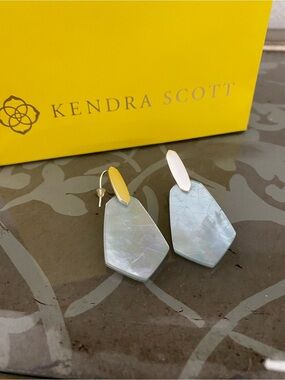 Kendra Scott Camila earrings 
Beautiful blue stone with gold tone
Excellent